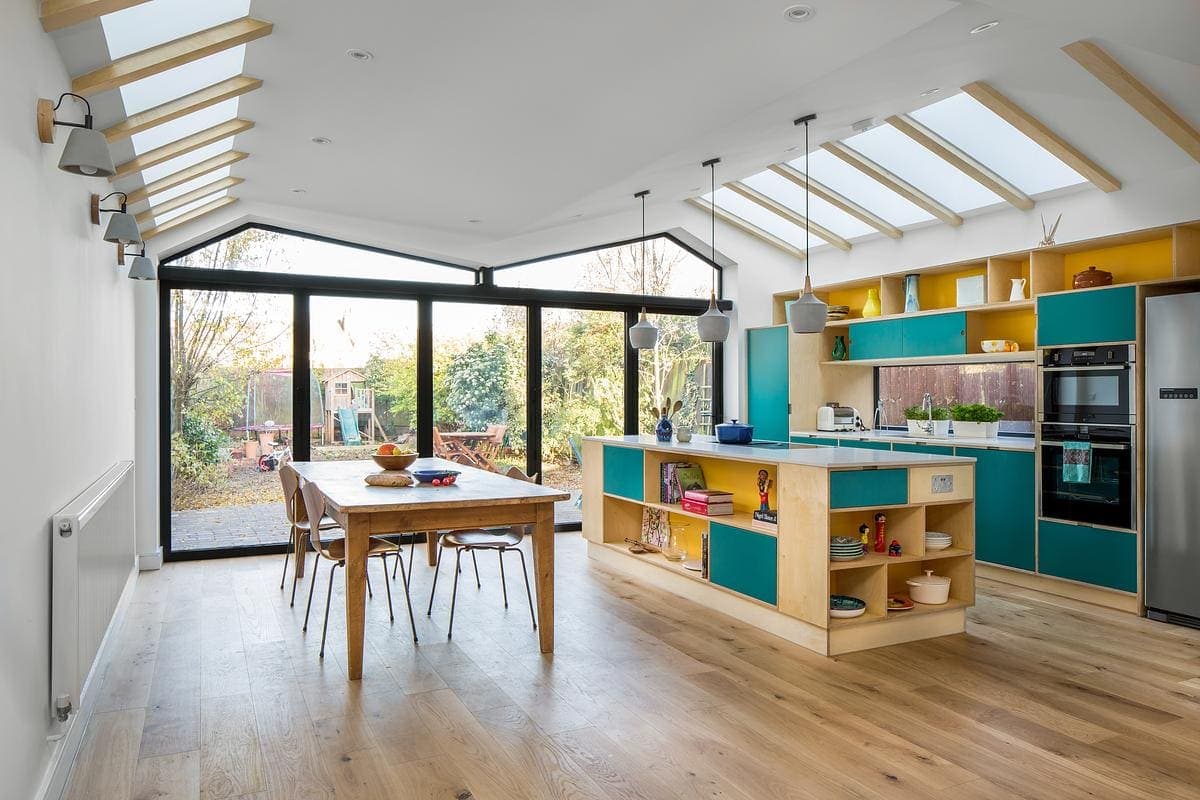 Rear extension and asymmetrical butterfly roof at Elmhurst Avenue by Iguana Architects