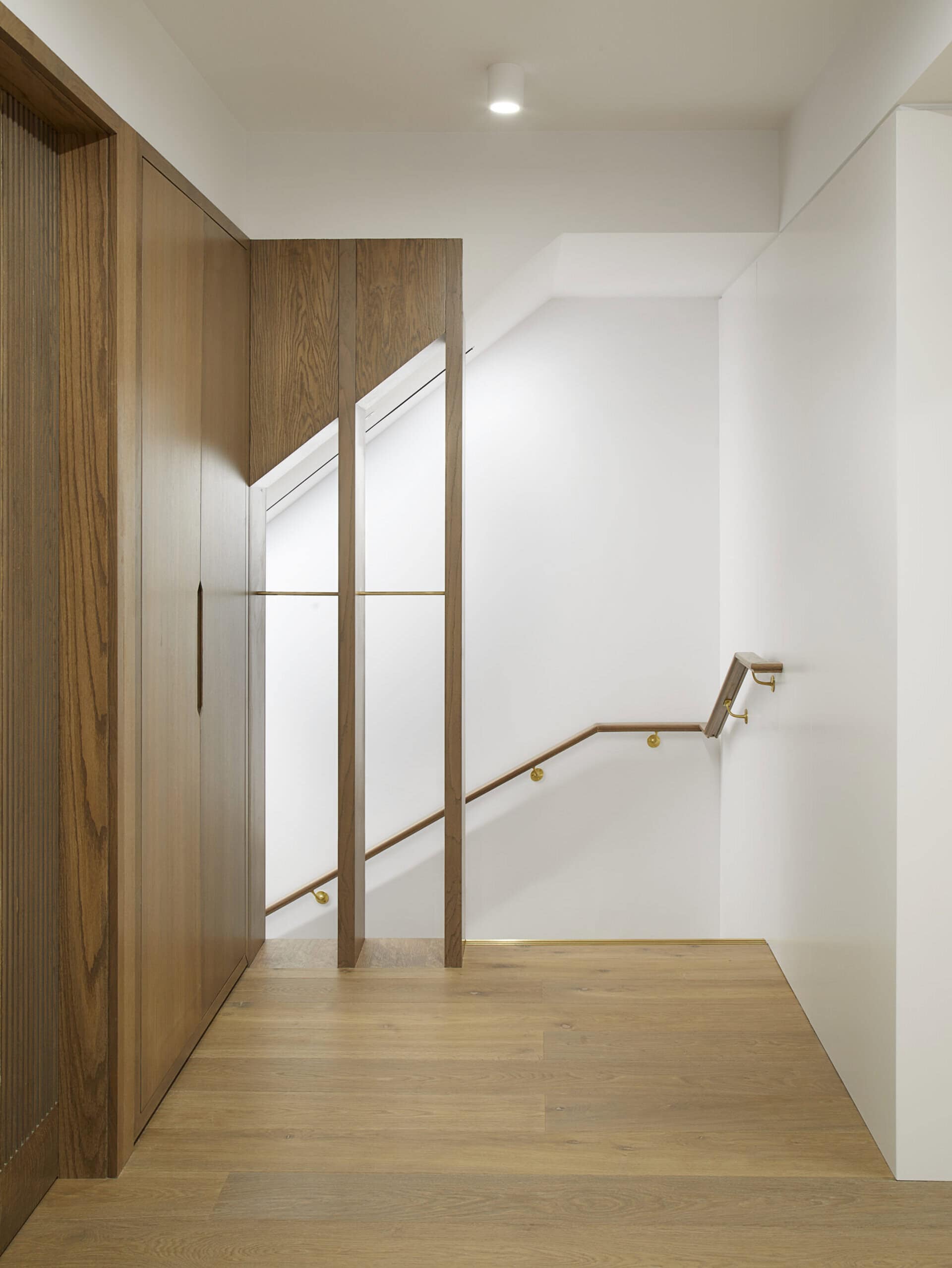 Stair beside a window.