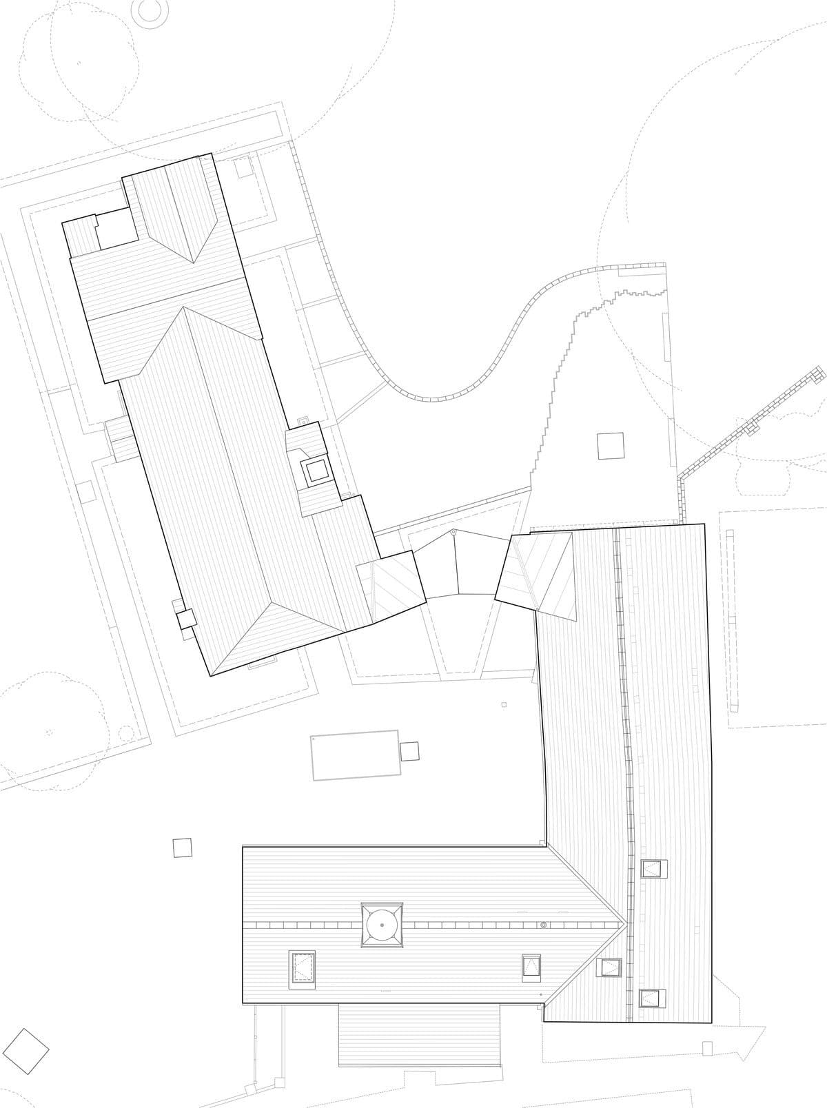 Architectural floor plan of a building complex with interconnected rectangular and L-shaped structures.