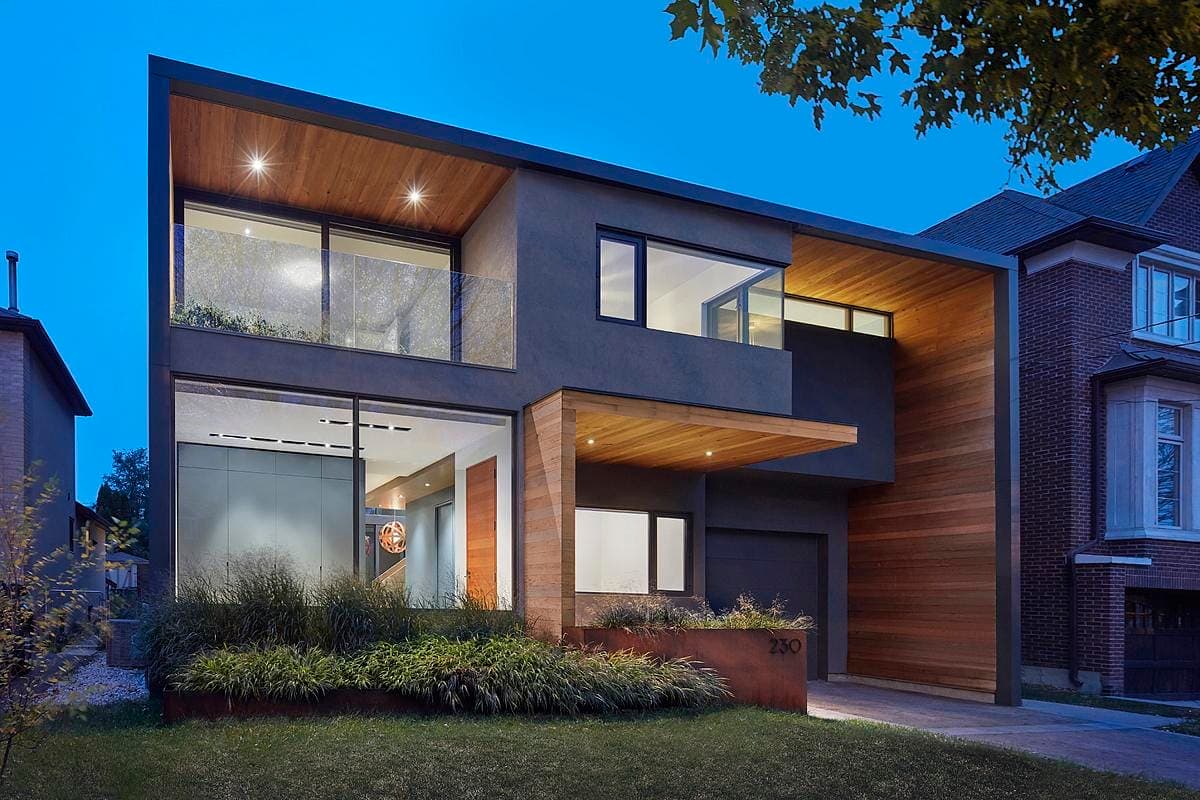 Modern two-story house with floating design, large windows, and sleek contemporary architecture.