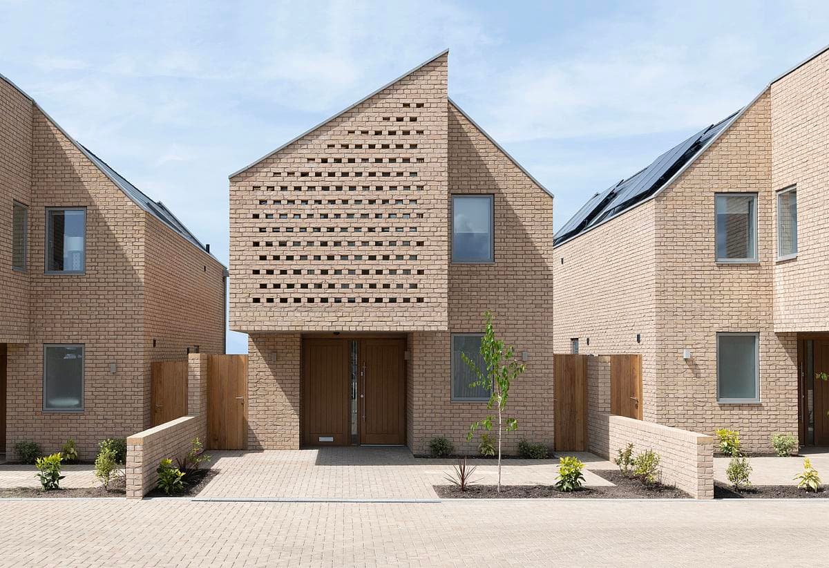 Contemporary sustainable homes with striking architecture in a beautifully landscaped residential area.
