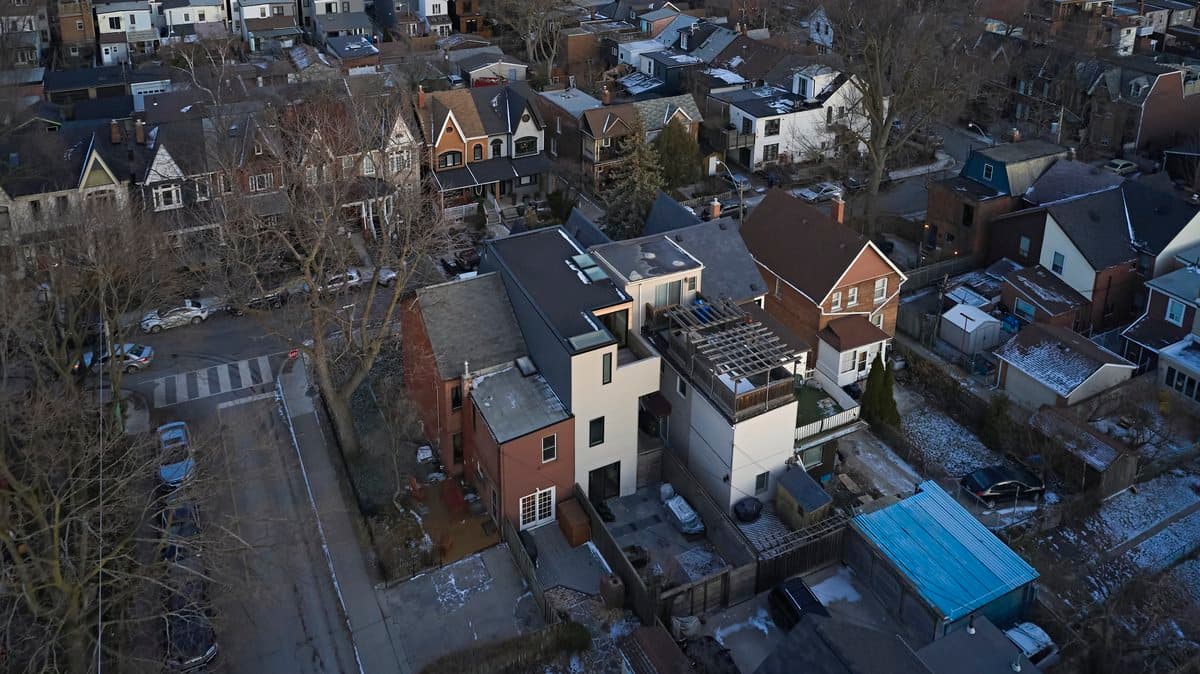 Aerial view of diverse suburban houses in late fall or winter season.