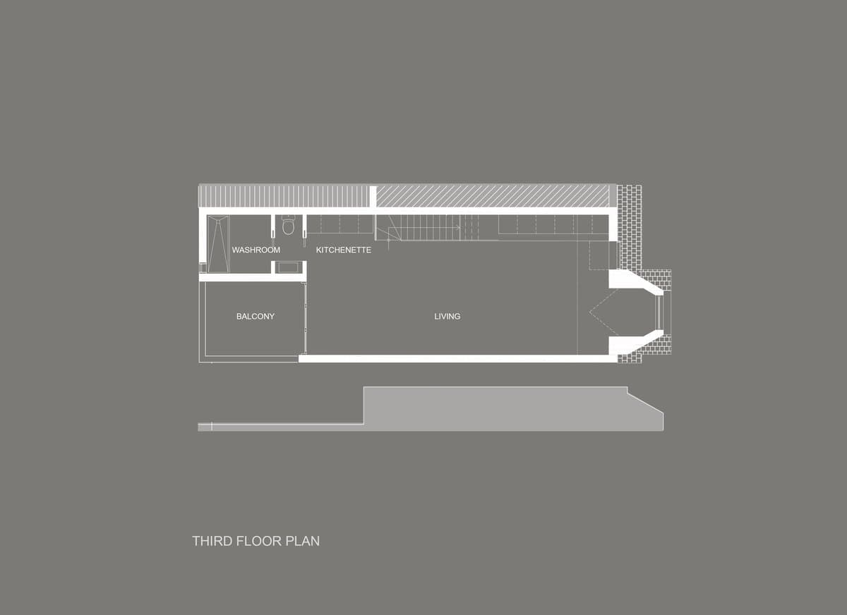 Third floor plan featuring bathroom, closet, large living area, and staircase.