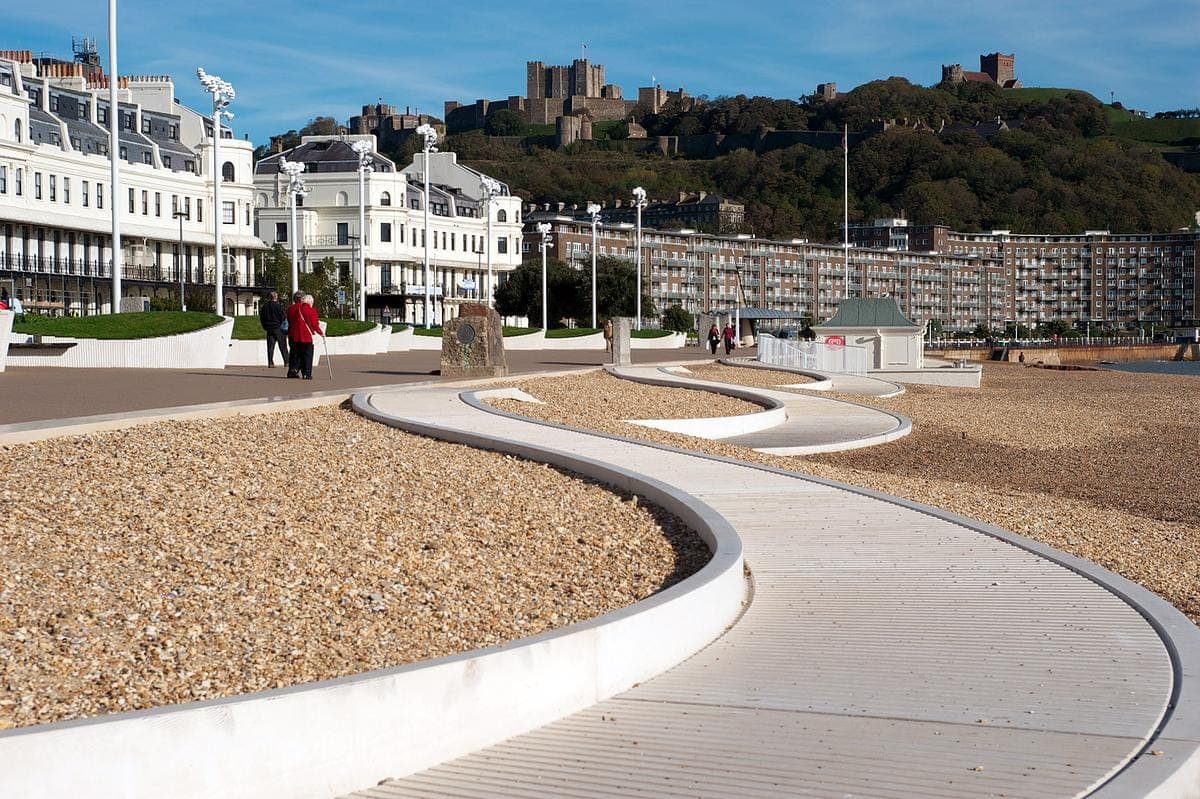 Curved promenade and seating along the seafront.