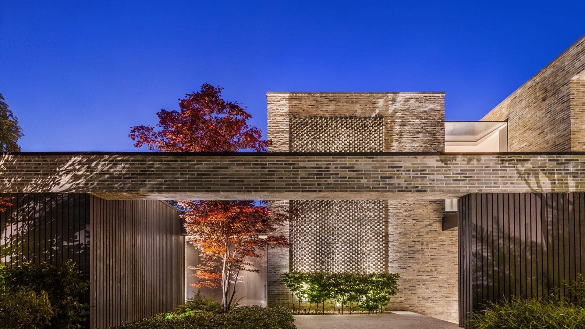 Brick and timber define the more enclosed street elevation