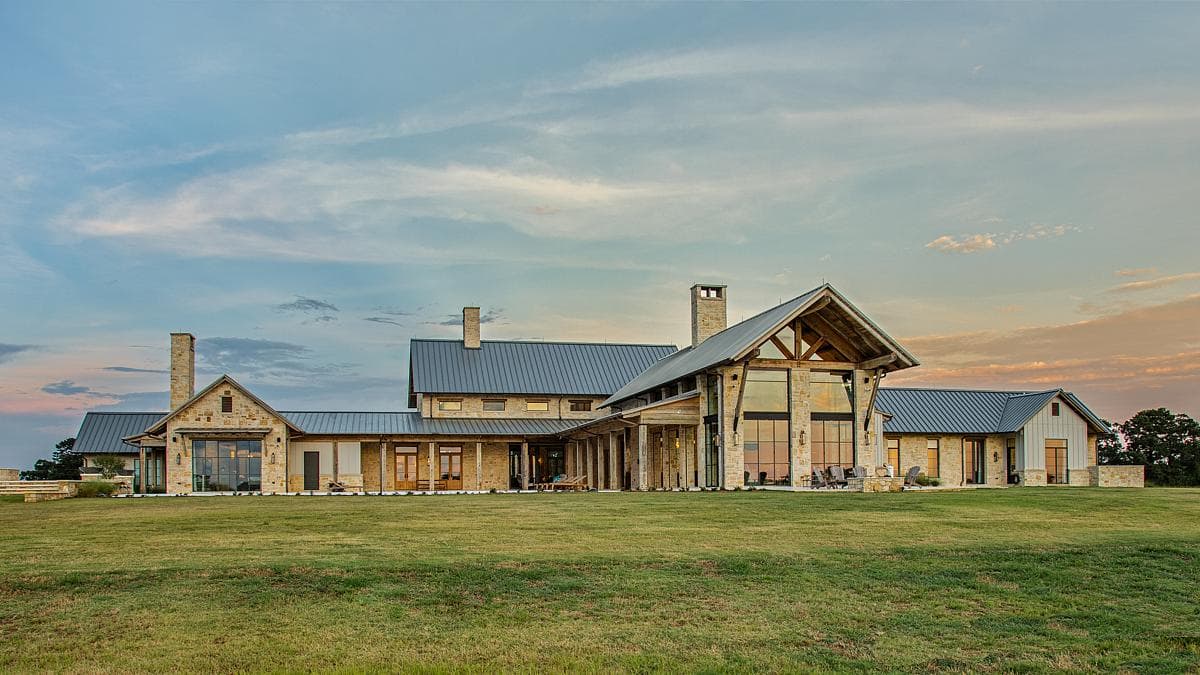 The low ranch house extends across the open landscape.