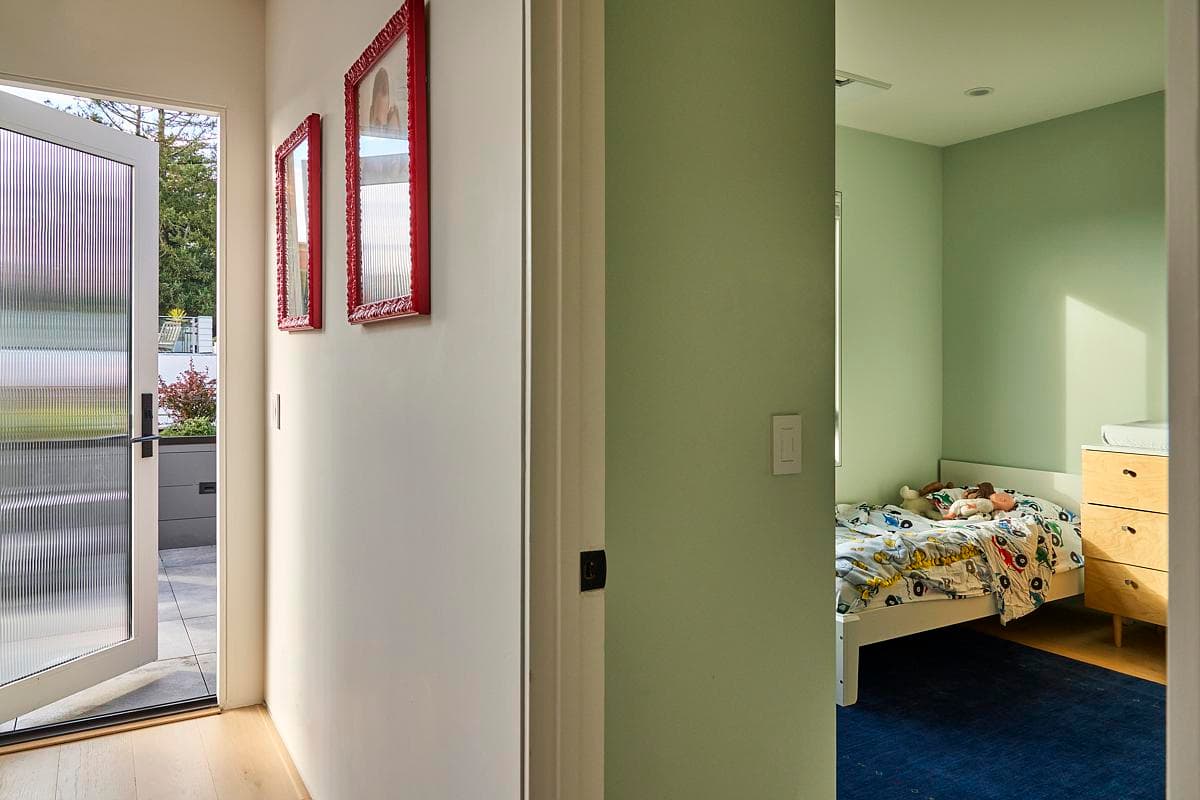 Colour marks the threshold between the hall and bedroom.