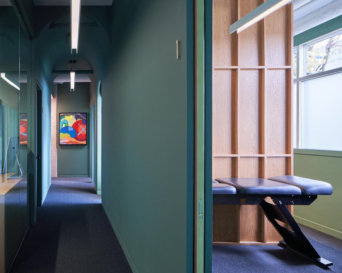 Green corridor and oak-framed treatment room
