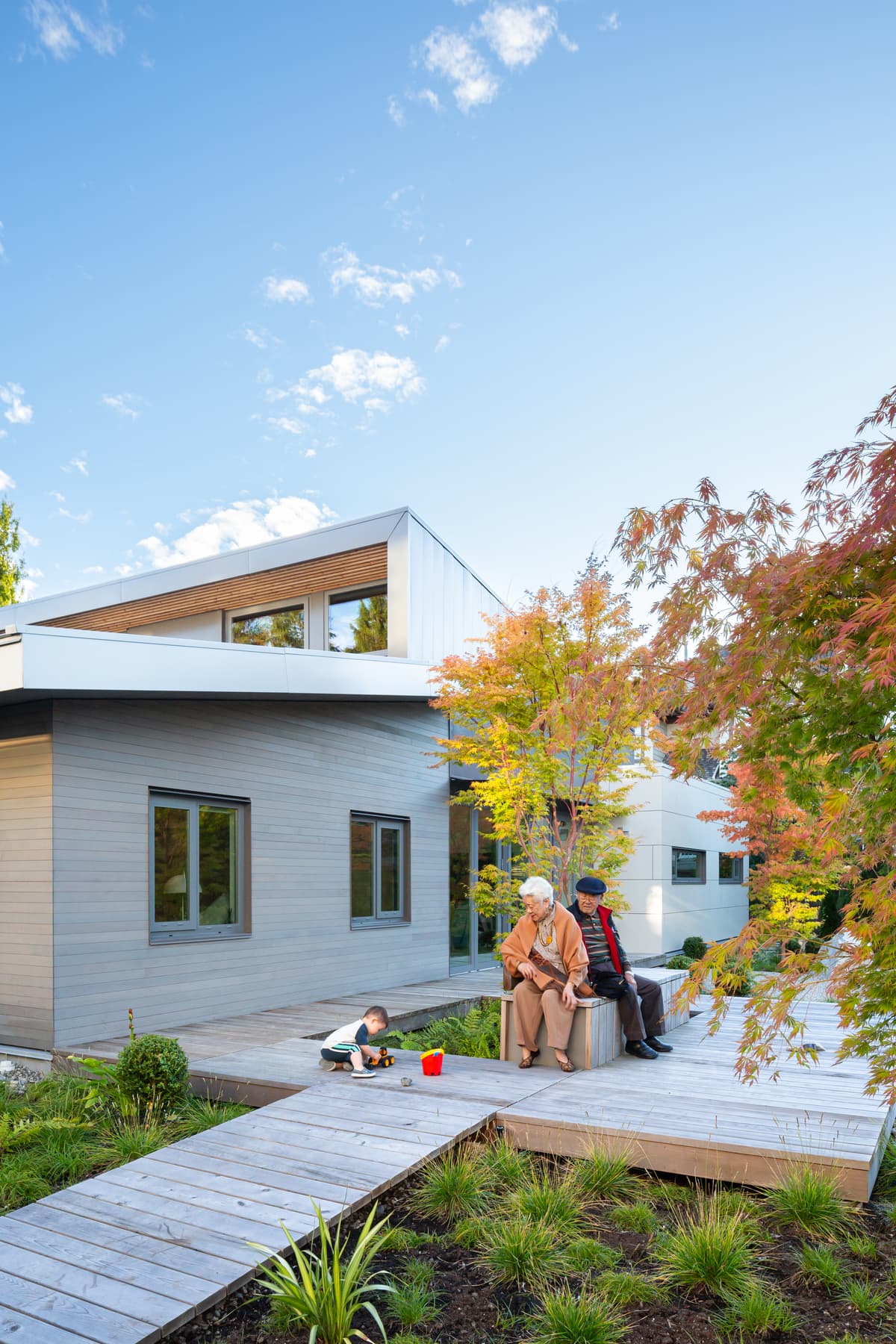 A timber deck provides a place to gather beside the garden.