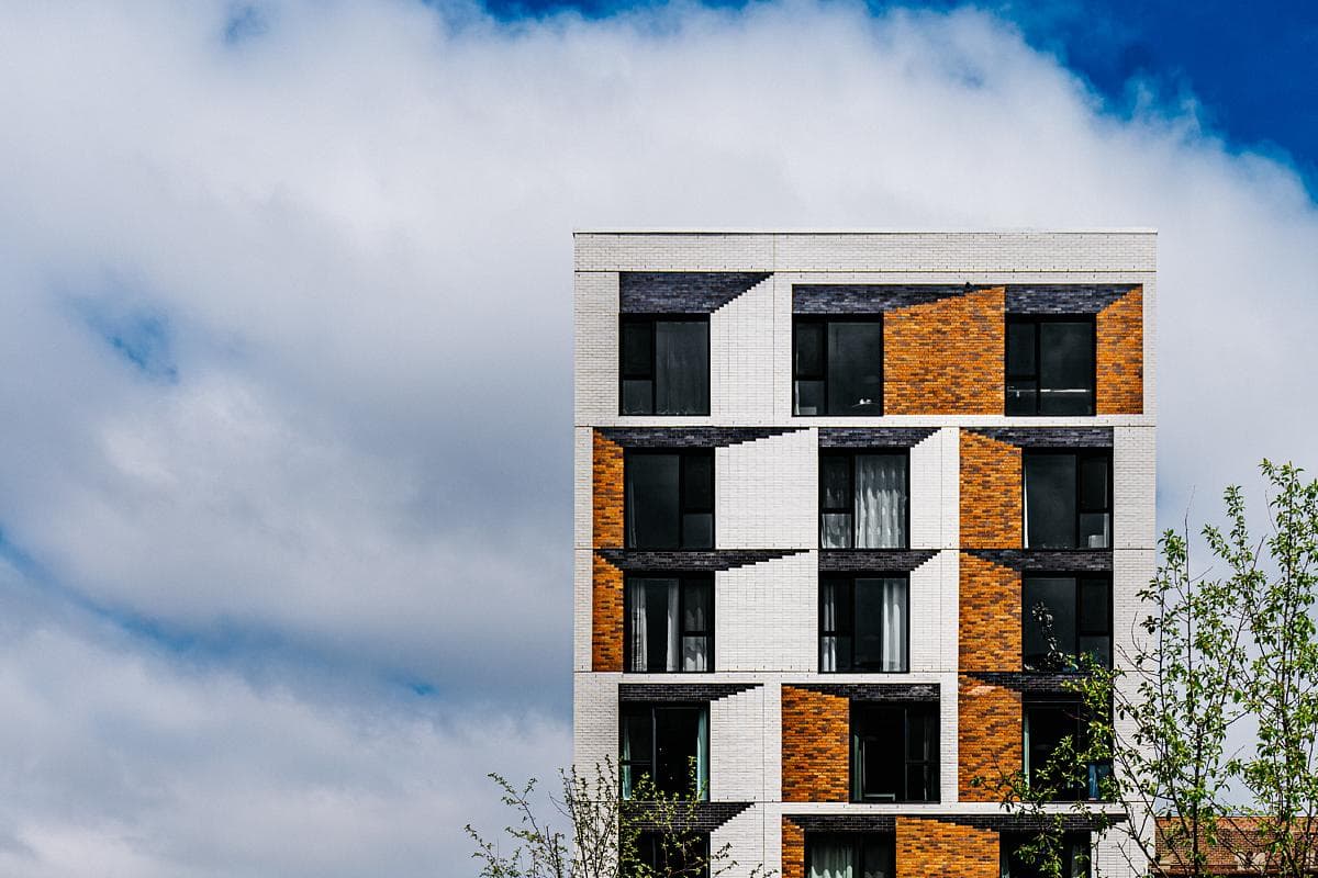 Contrasting brick panels create an optical effect around the windows.