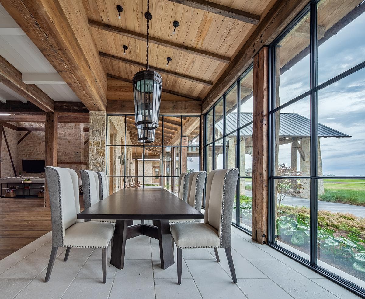 The glazed dining room beside the courtyard.