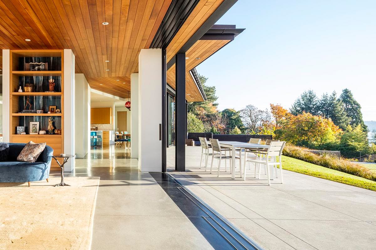 Timber ceilings continue from the living area towards the open patio