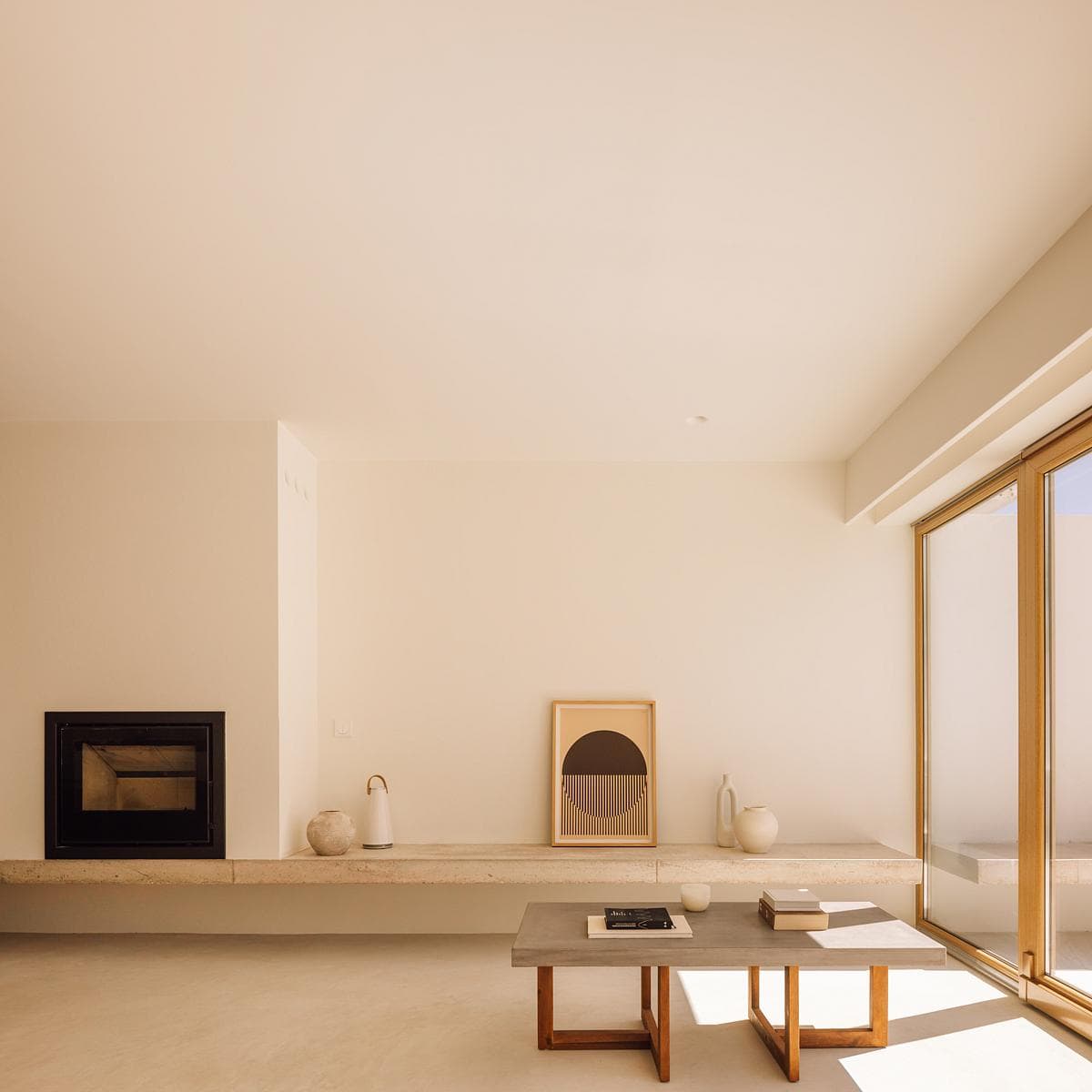 A low hearth runs along the living-room wall.