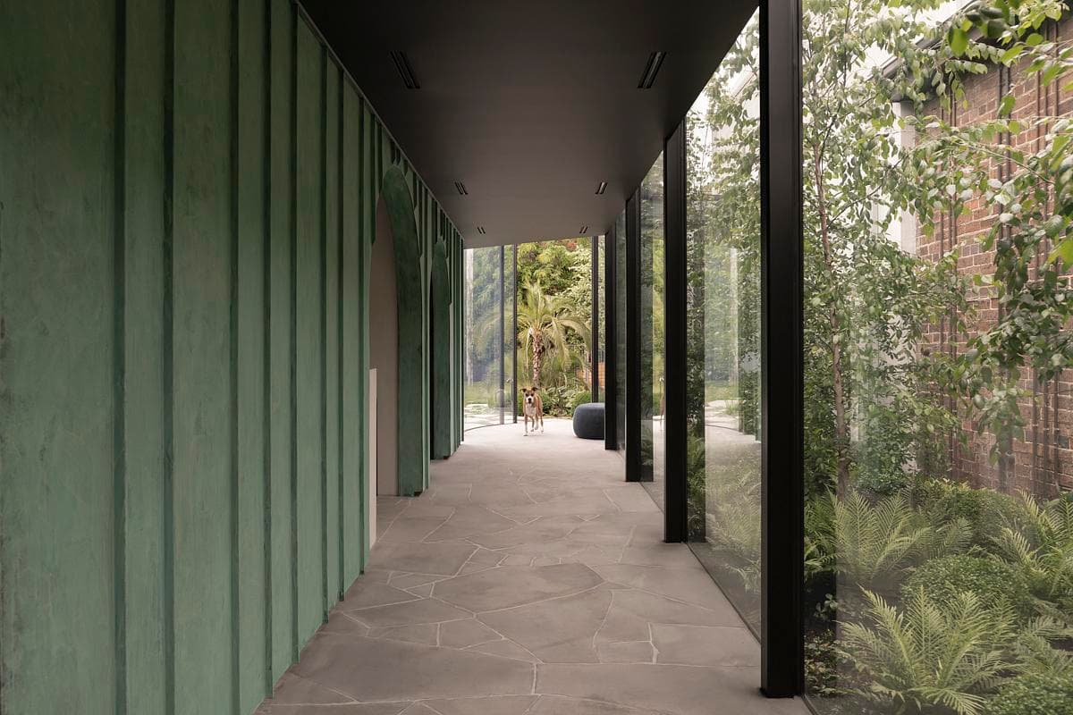 A glazed walkway links the new wing with the existing house.