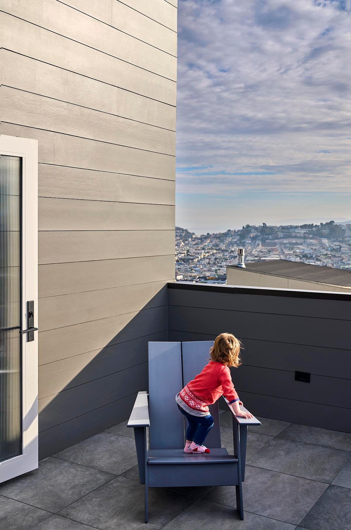 The upper terrace provides an outdoor space above the city.
