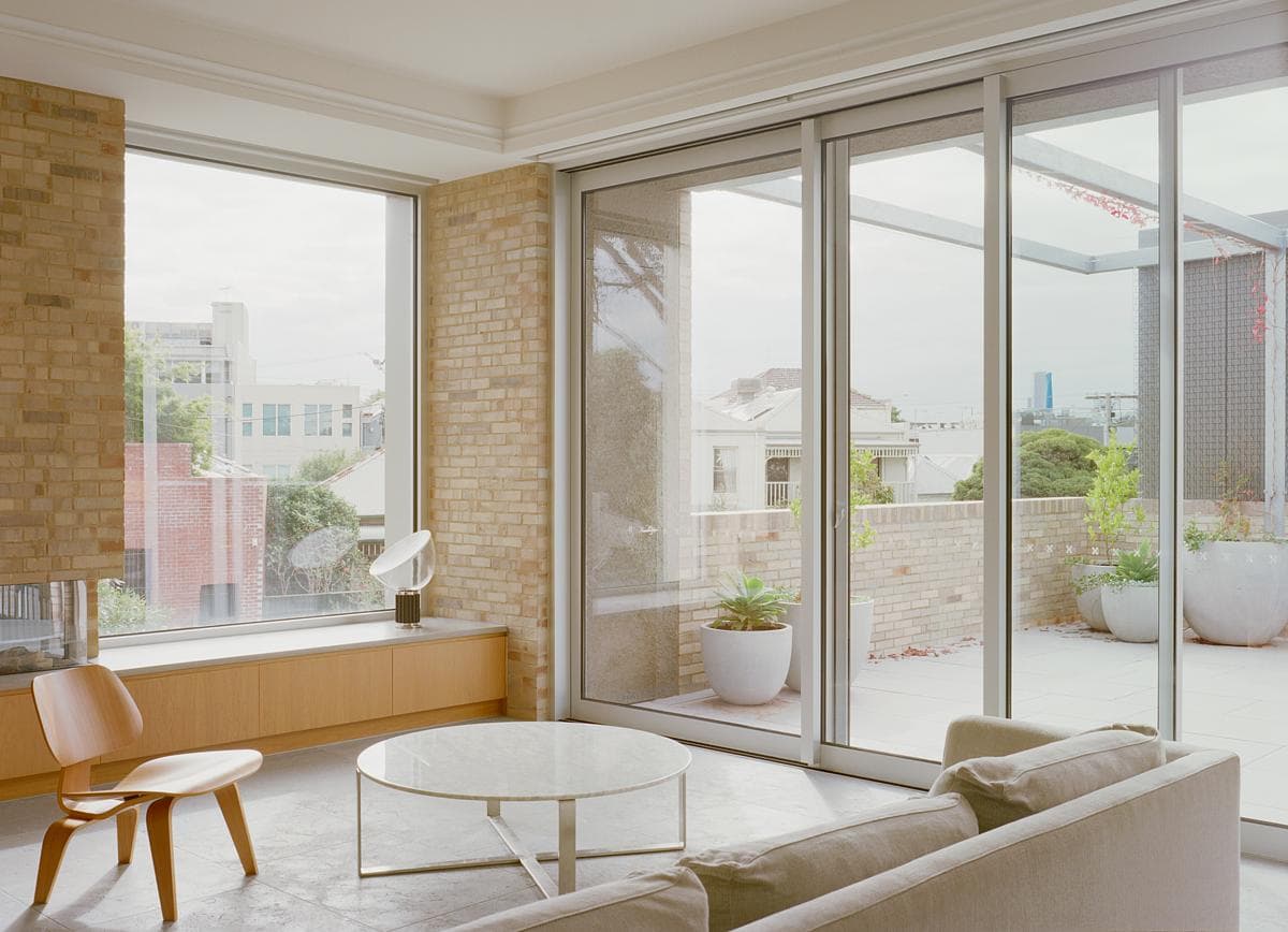 The first-floor living room opens towards a private terrace.