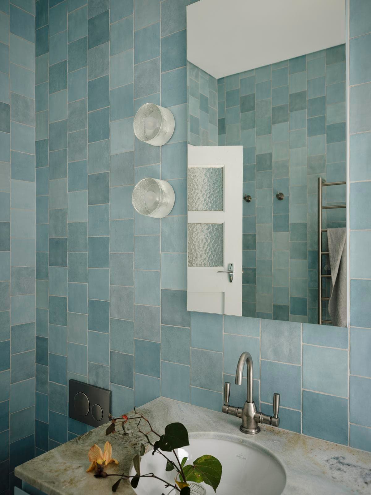 Handmade blue tiles around the bathroom basin