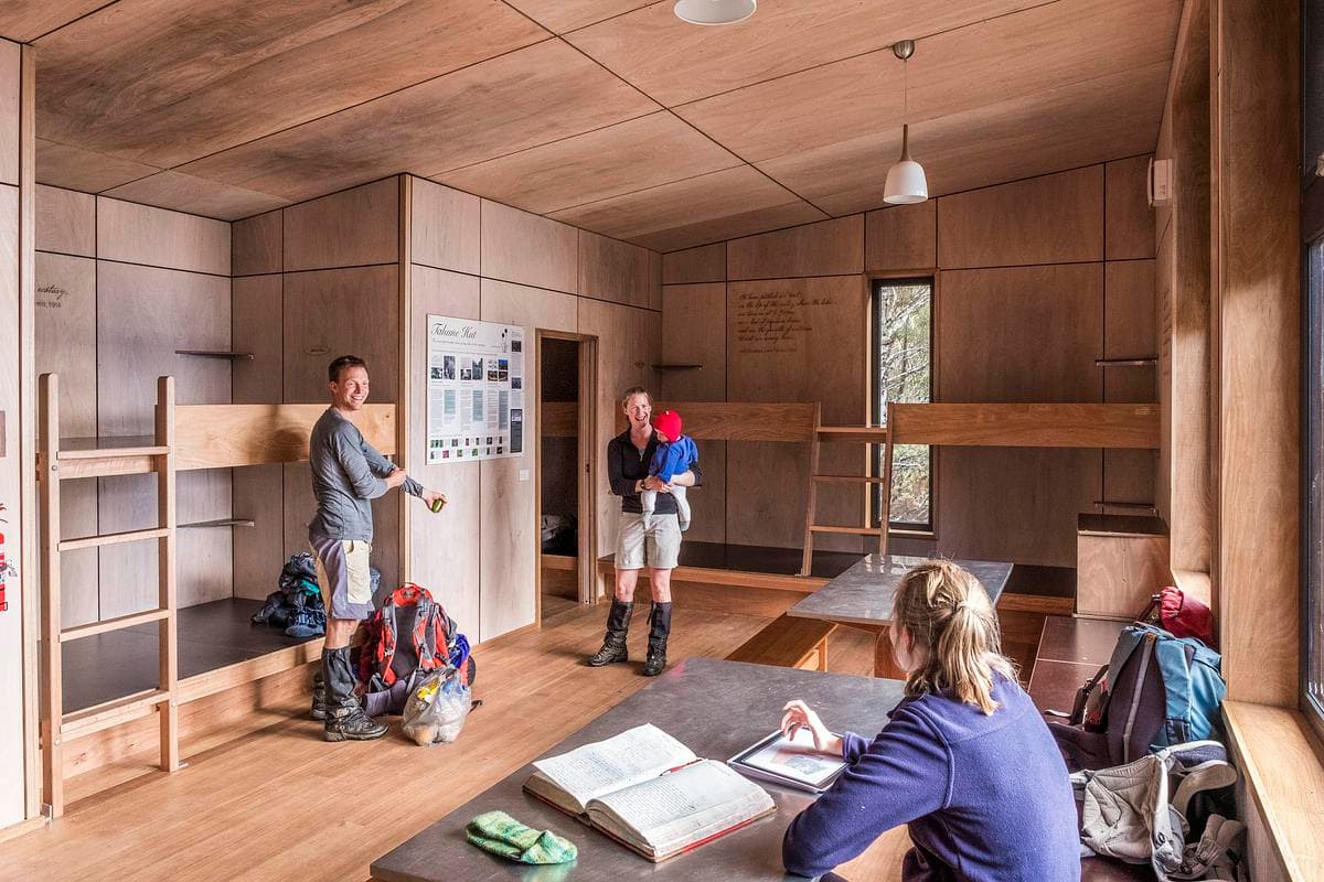 A shared timber-lined room gives walkers space to unpack and rest.