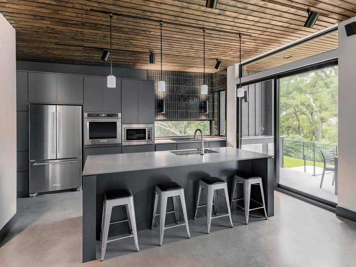 Kitchen island and full-height glazing towards the garden