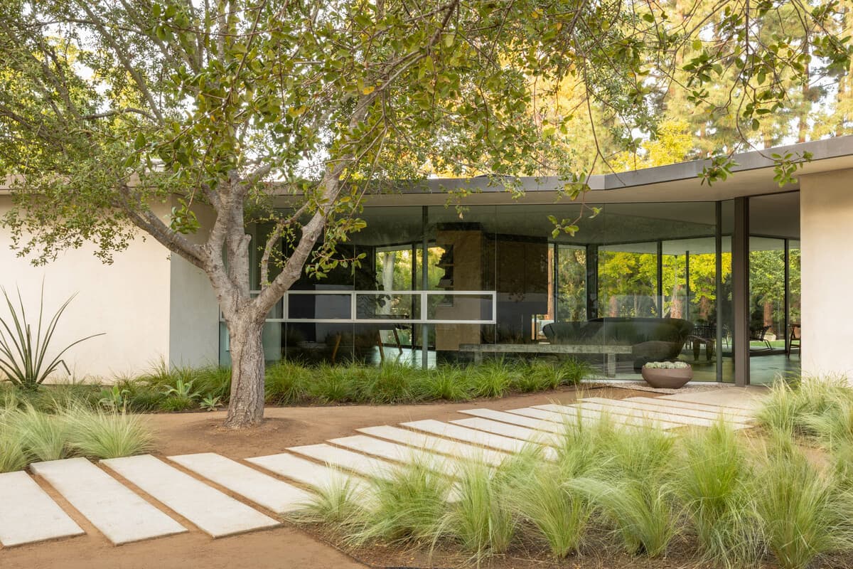 The front garden and glazed entrance to the house