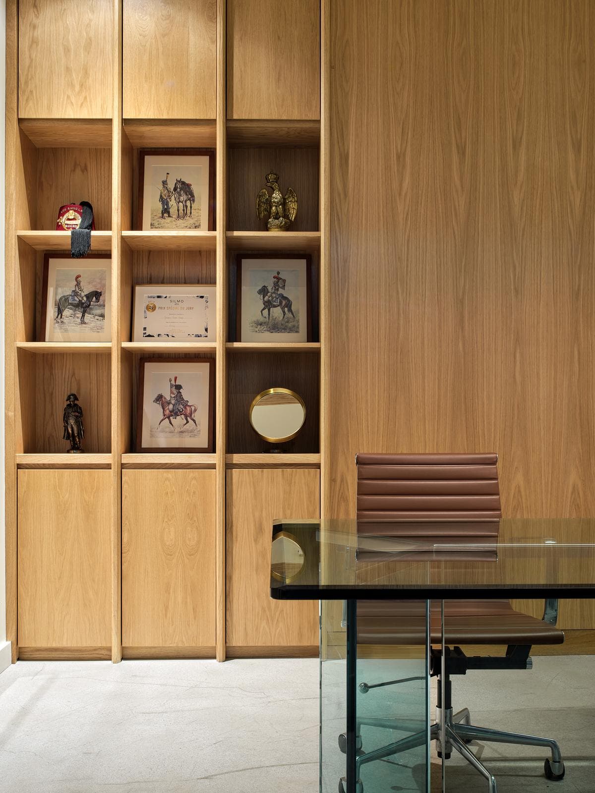 A timber desk and faceted joinery detail in one of the private workspaces.