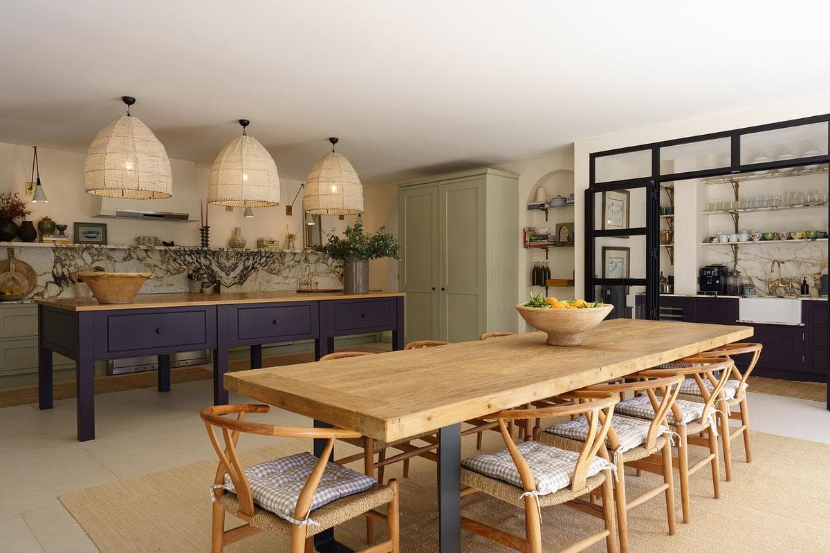 Kitchen island, woven pendants and adjoining dining area