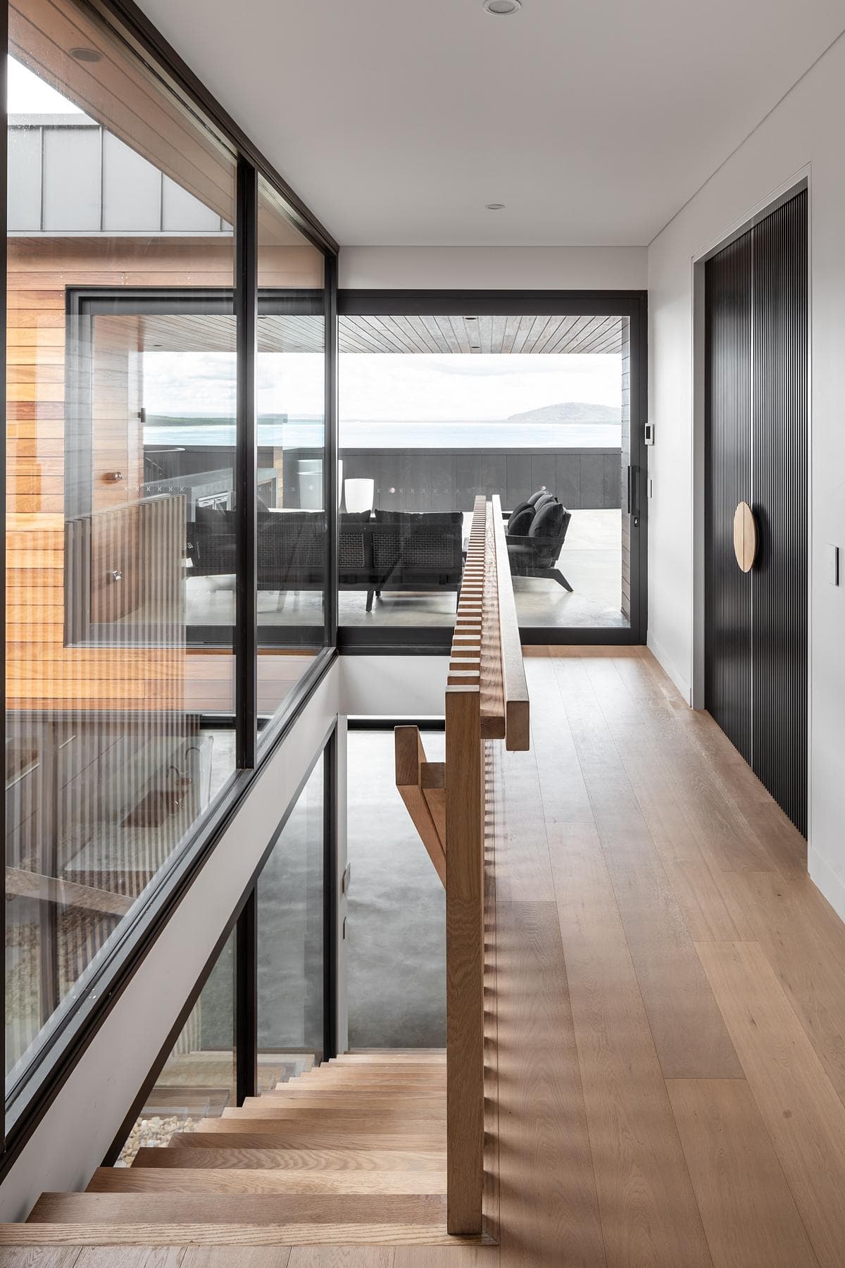 A stair and glazed passage connect the interior spaces.