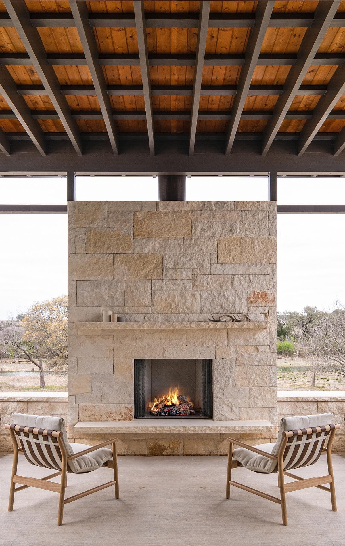 Fireplace and seating within a covered outdoor room