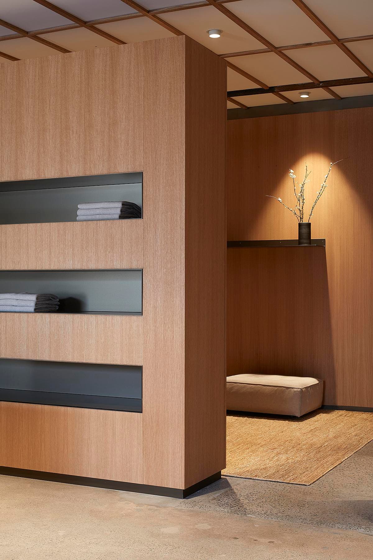 Oak display wall with inset dark shelves