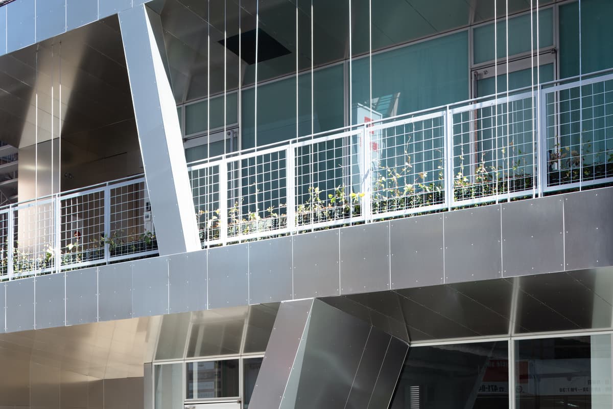 A folded aluminium terrace meets the glazed frontage
