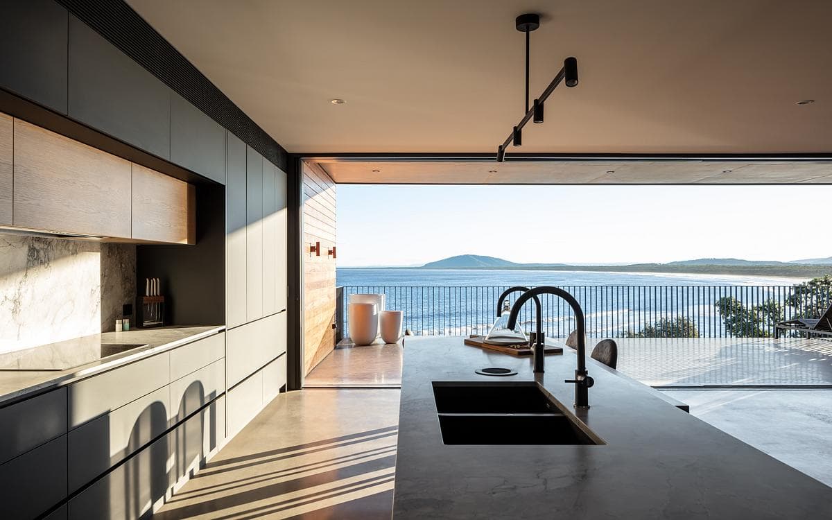 The kitchen looks out towards Seven Mile Beach.