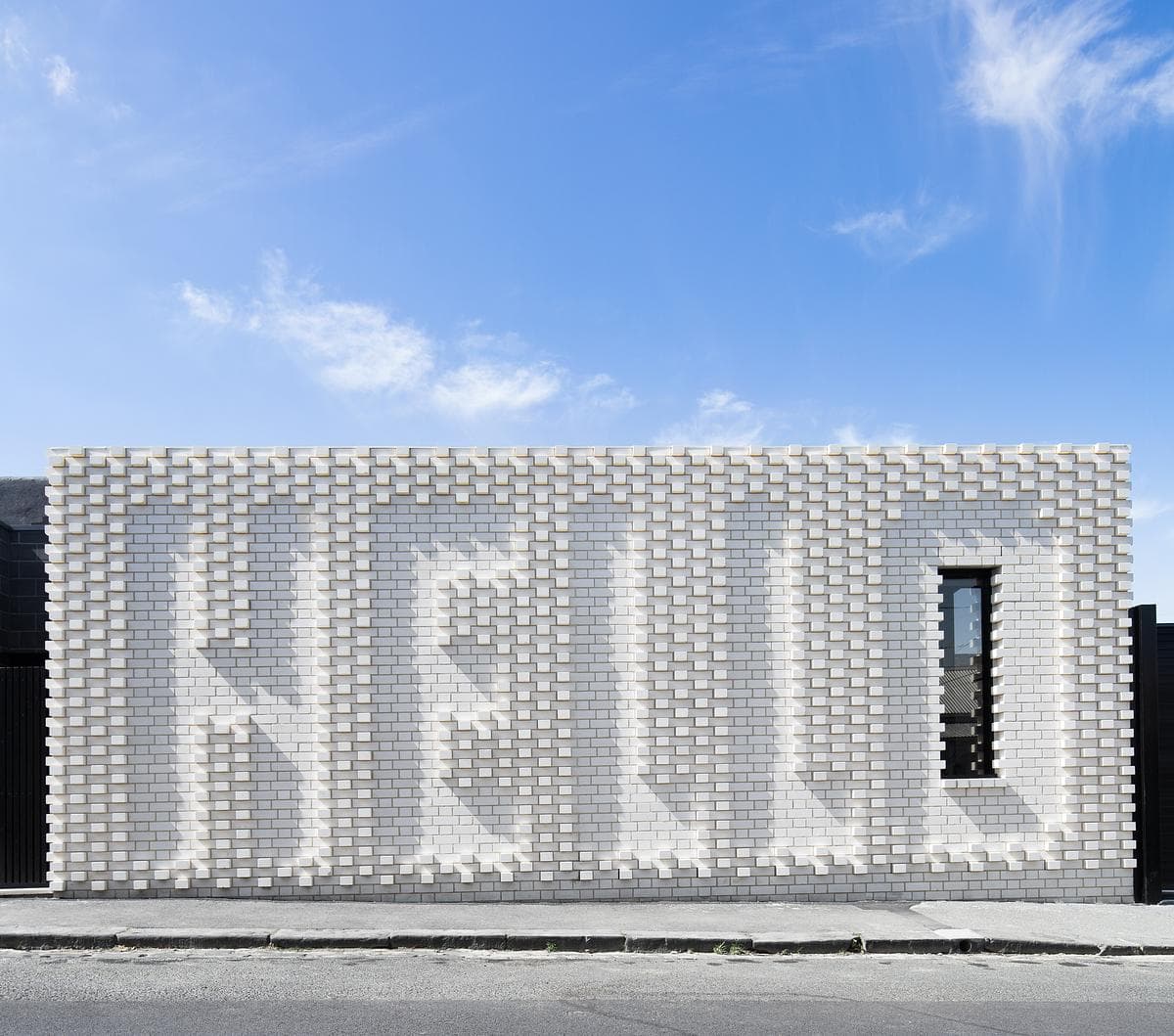 A frontal view of the brick wall developed with artist Rose Nolan.