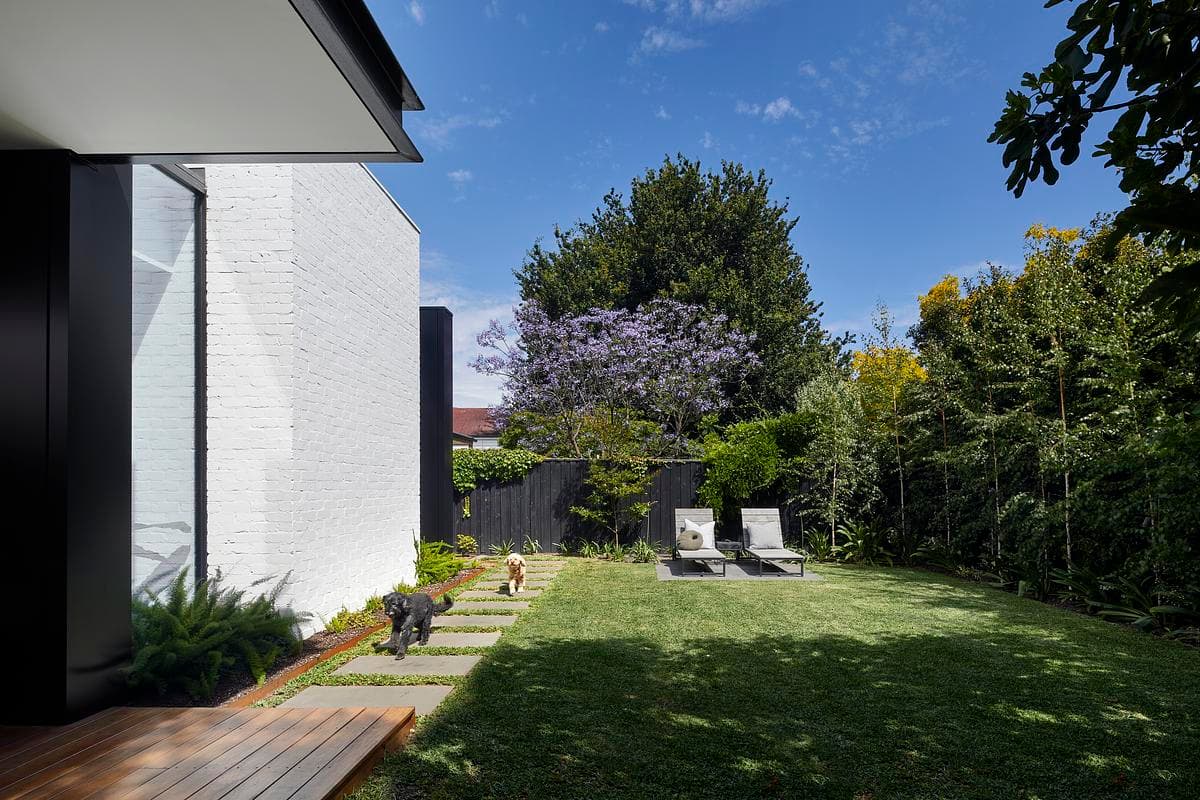 The white-painted addition beside the rear garden.