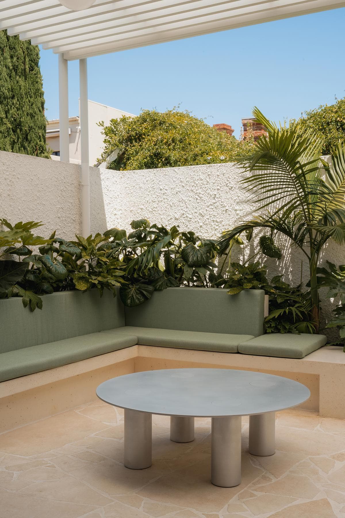 City Cottage: a lightcourt with planting and integrated seating