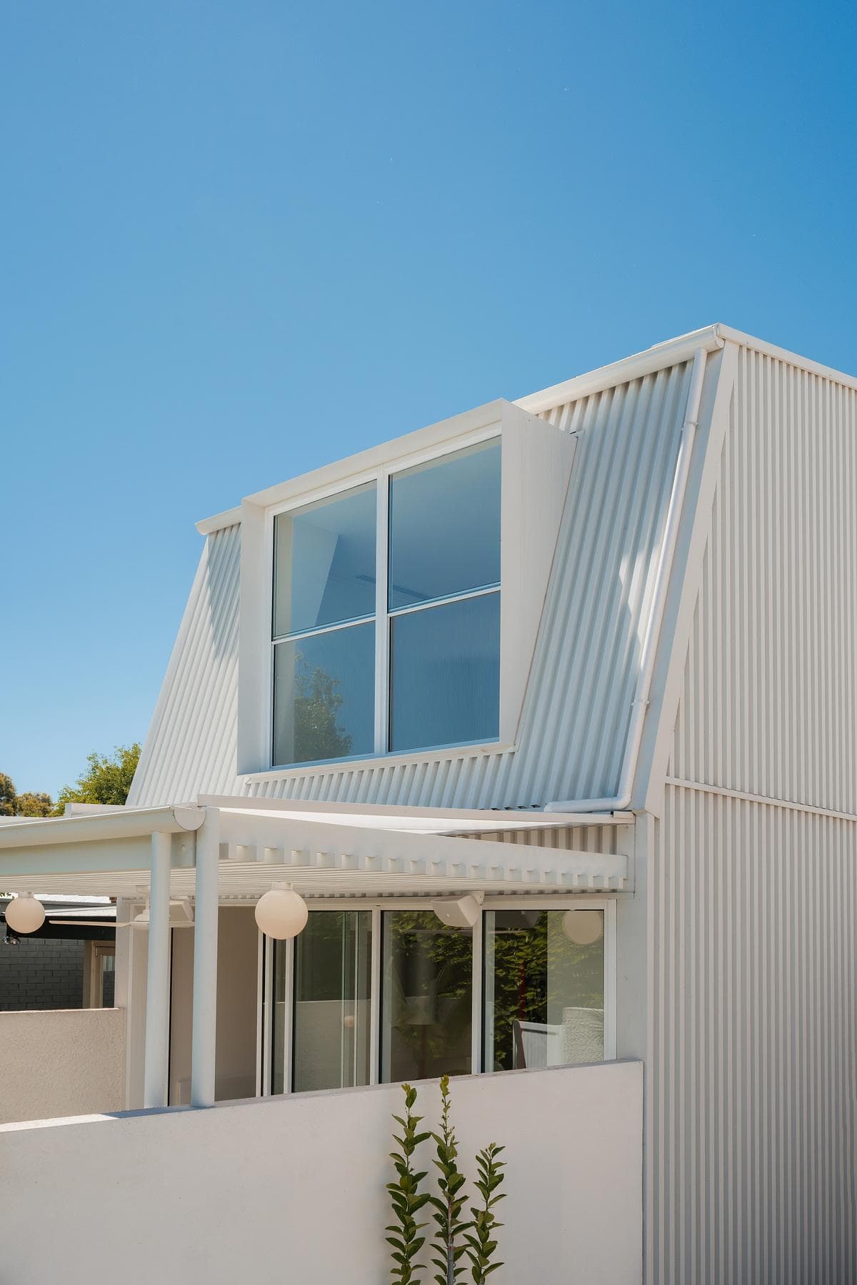 City Cottage: pale rear addition opening to the garden