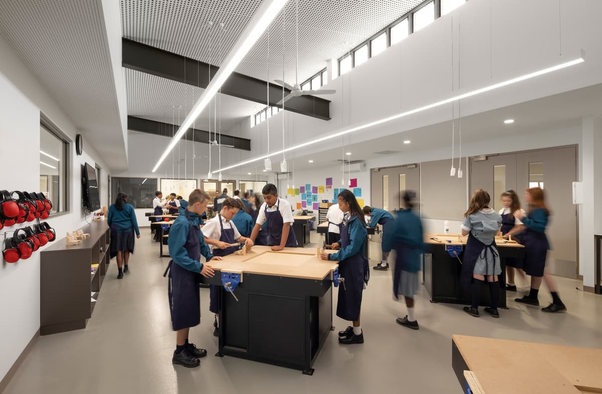 A practical learning space combines worktables and teaching areas.