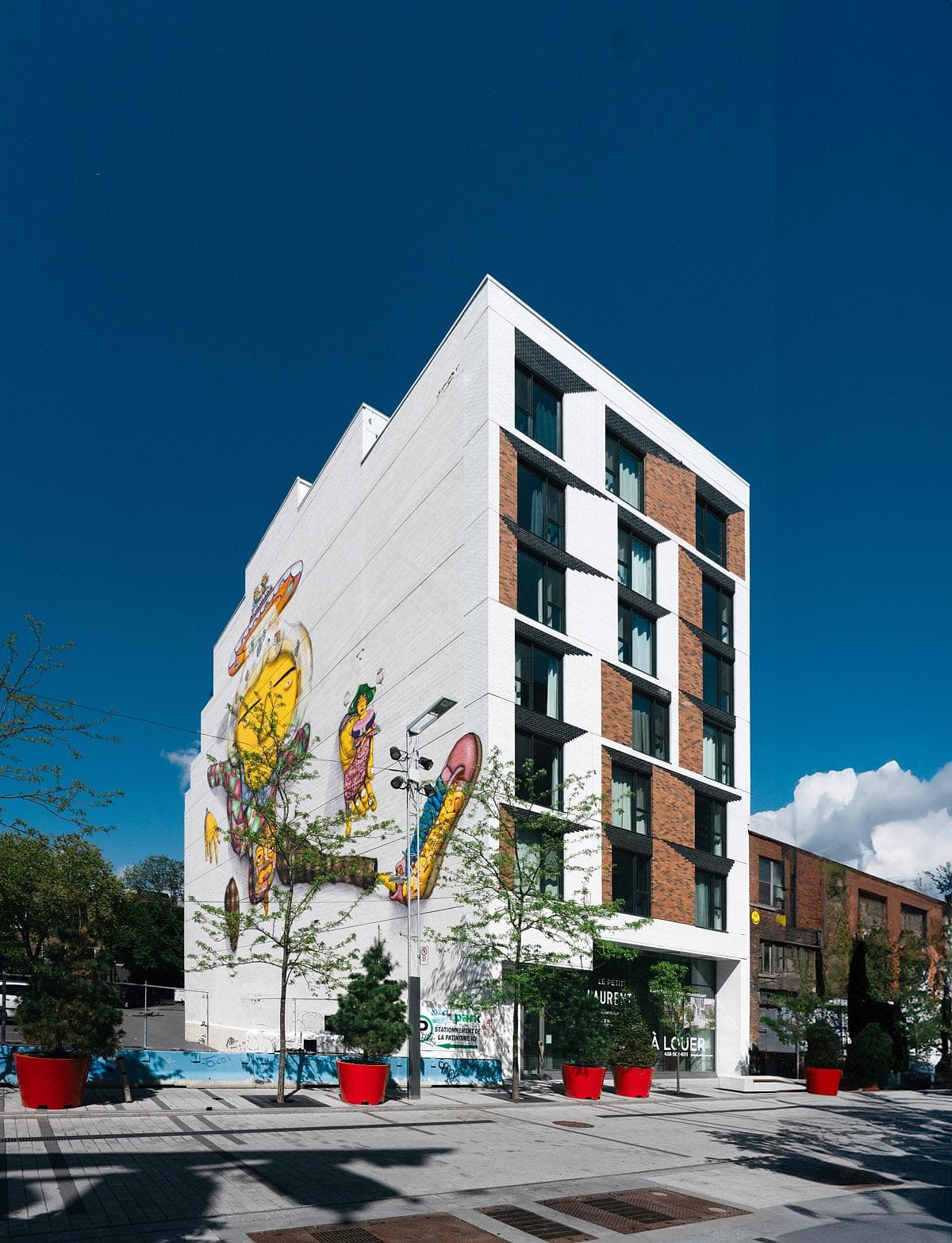 The Clark Street frontage combines contrasting brickwork with angled window frames.