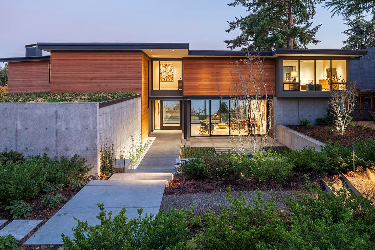 Boomerang House: the landscaped approach to the timber-clad entrance