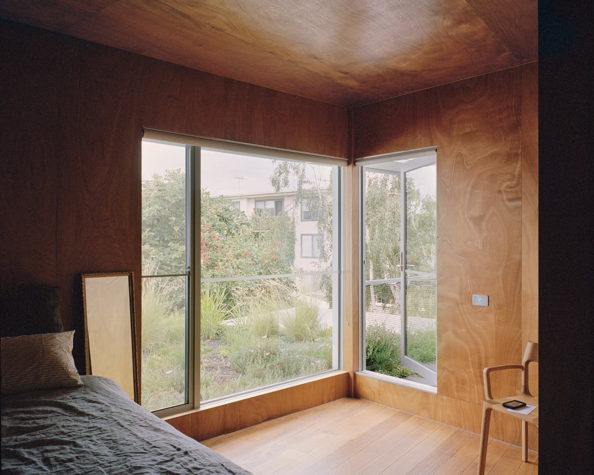 The upstairs bedroom looks towards planting on the roof garden.