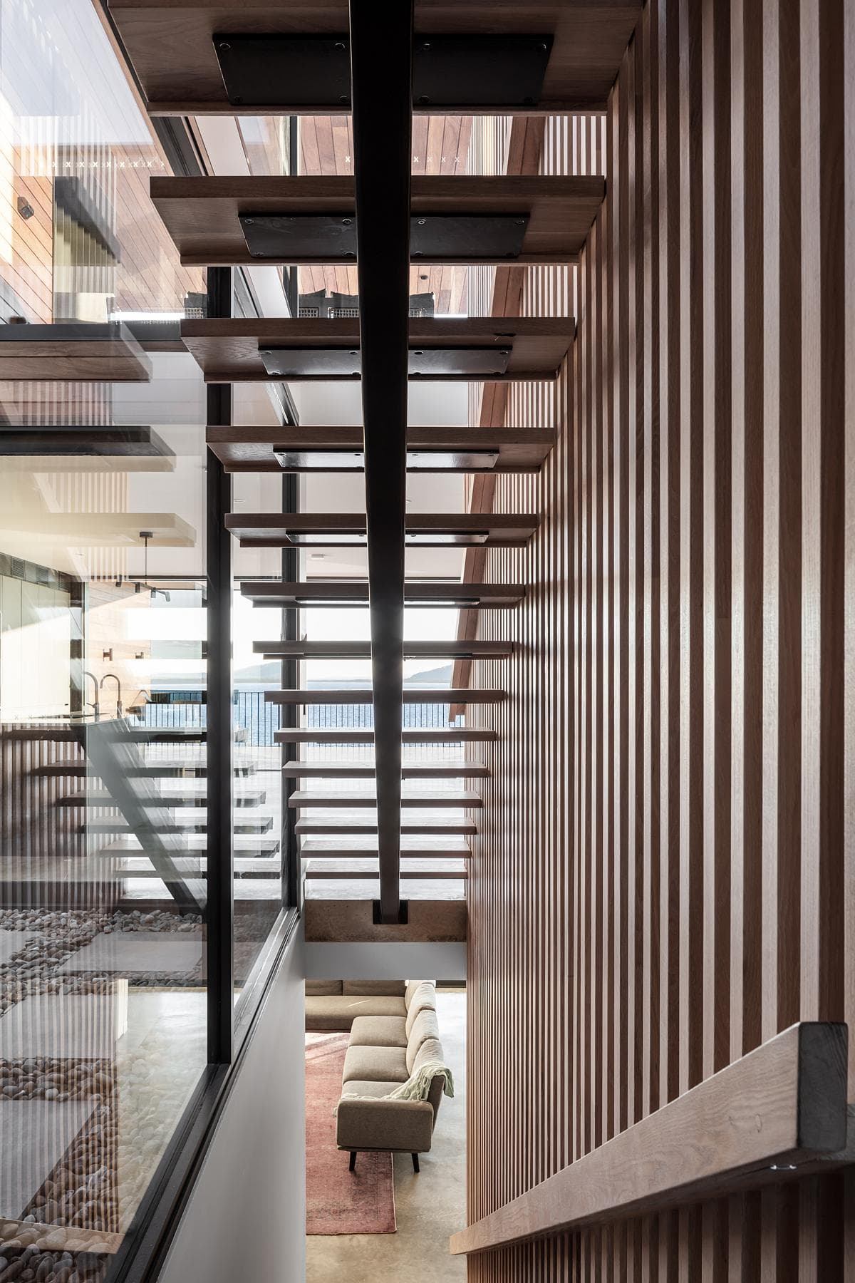 Timber battens screen the open stair.