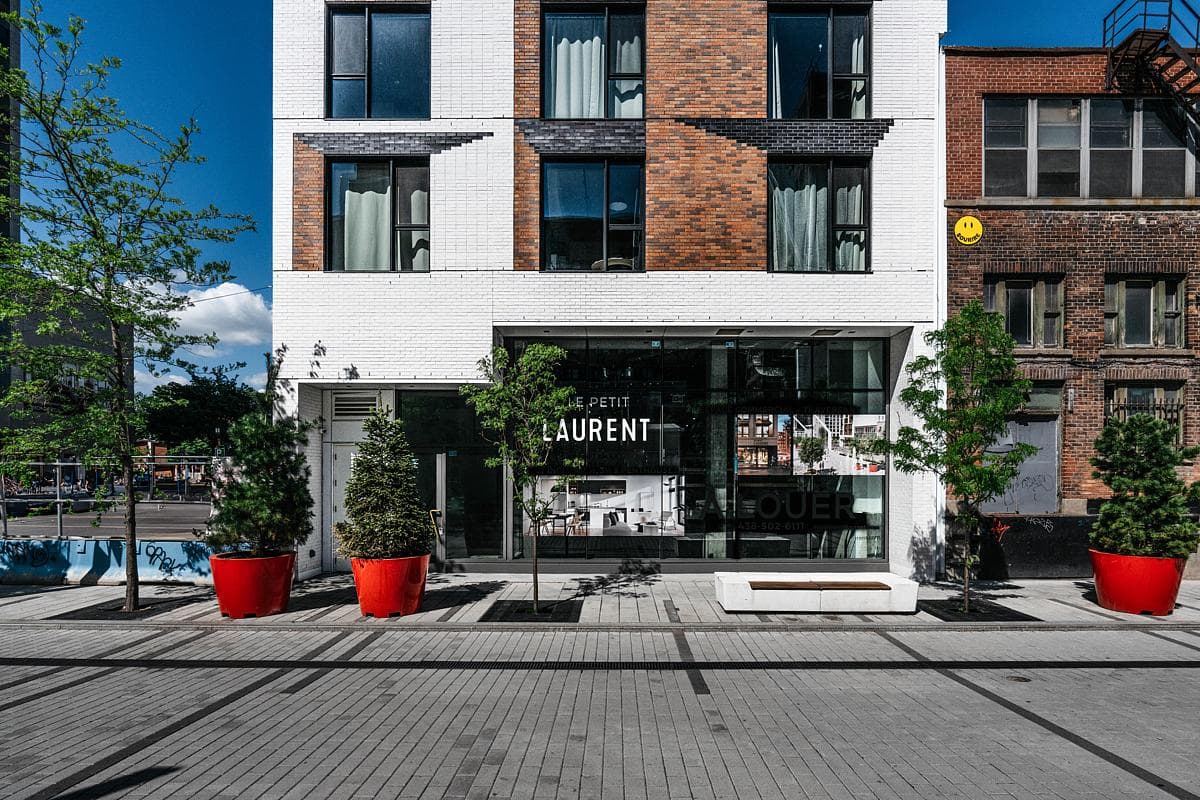 Le Petit Laurent's entrance sits within the patterned brick frontage.