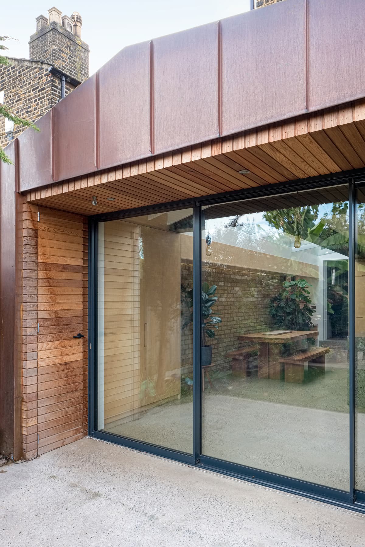 Copper cladding frames the large glazed garden doors.