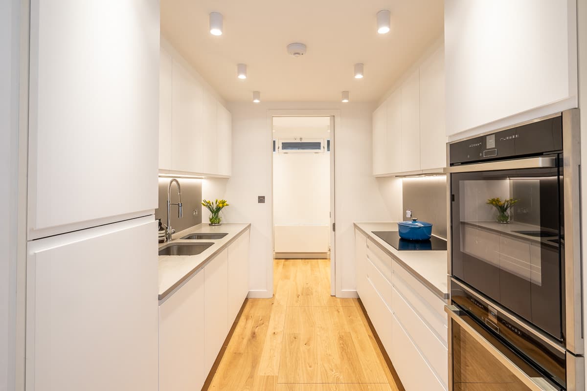 The kitchen sits alongside the main living and dining spaces