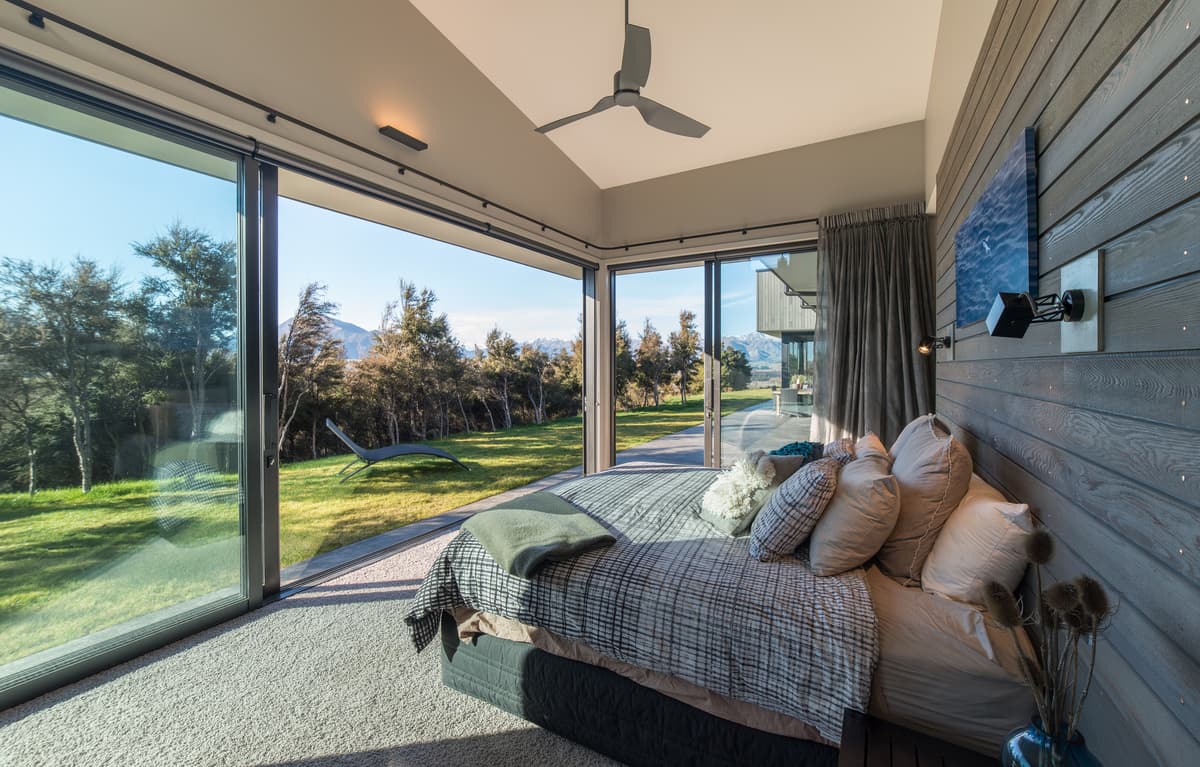 The bedroom opens towards a sheltered garden terrace