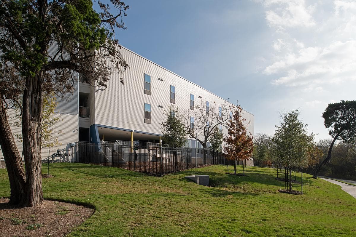 Street elevation and landscaped approach to the supportive housing community