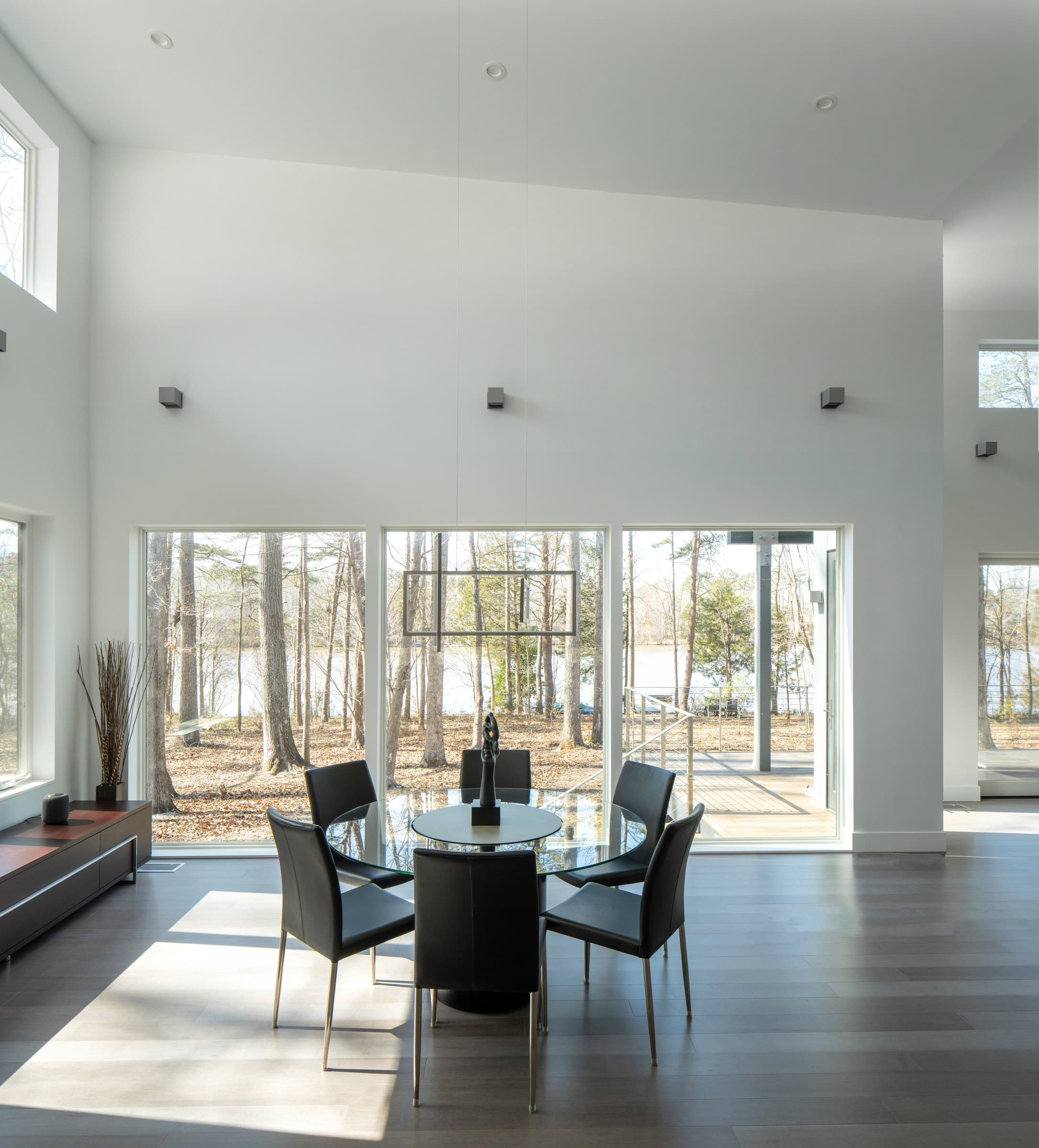Dining area with tall glazing and high-level windows