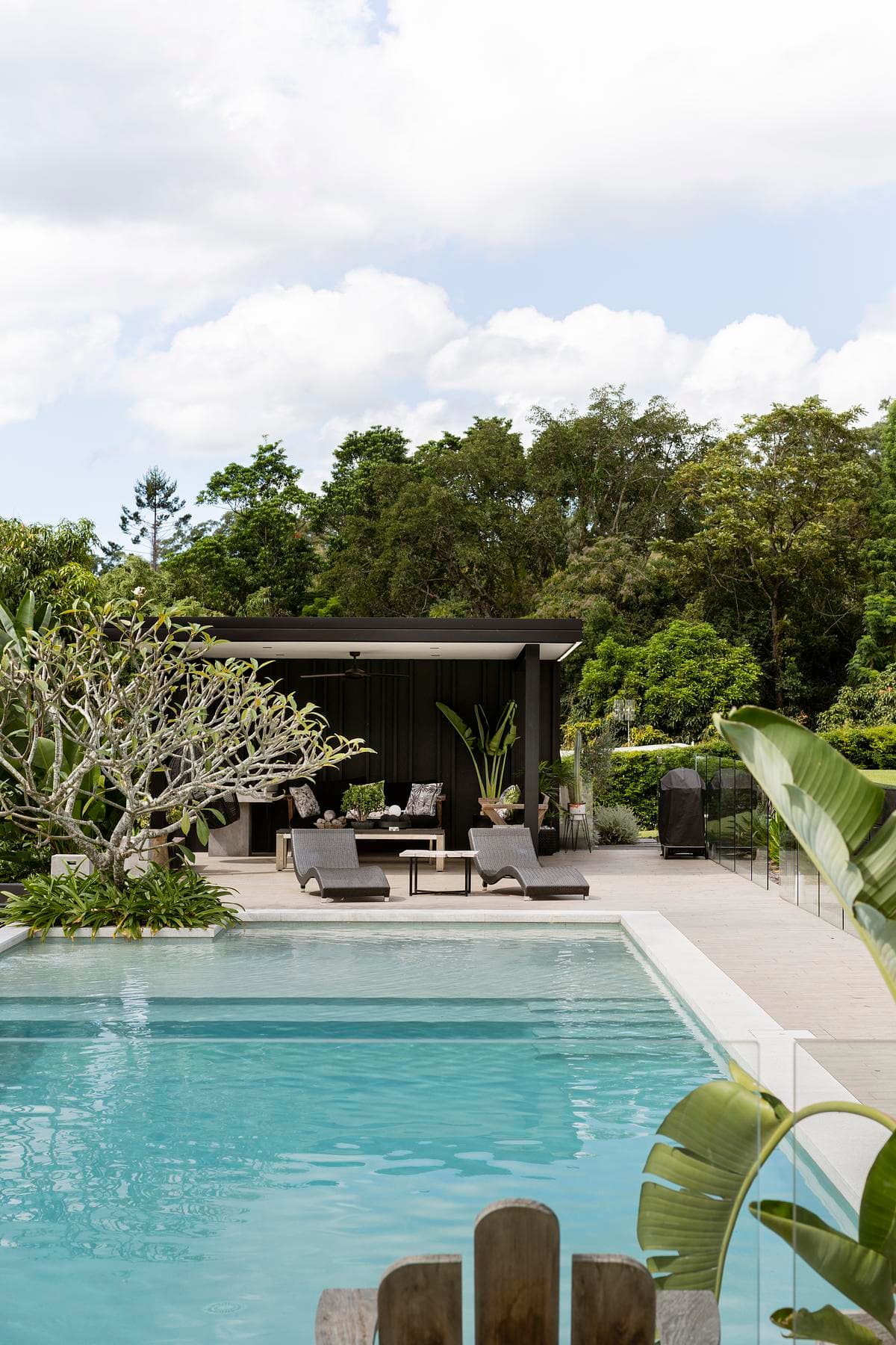 Pool edge and tropical planting beside the cabana.