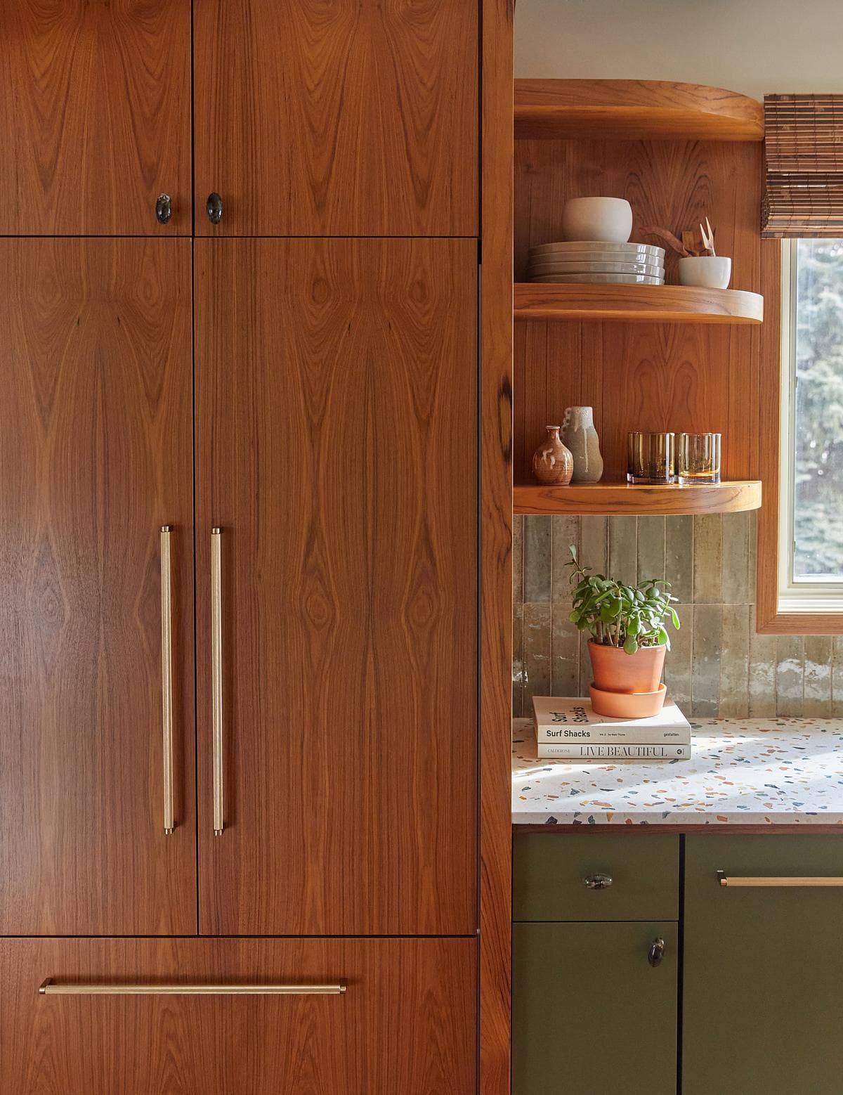 Timber cabinetry connects the kitchen with the existing palette.