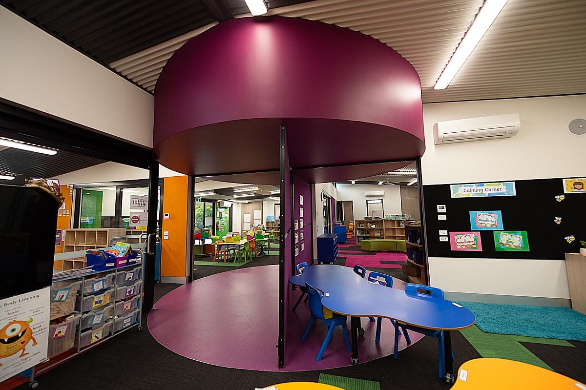 Curved purple breakout enclosure within the Stage 02 learning environment