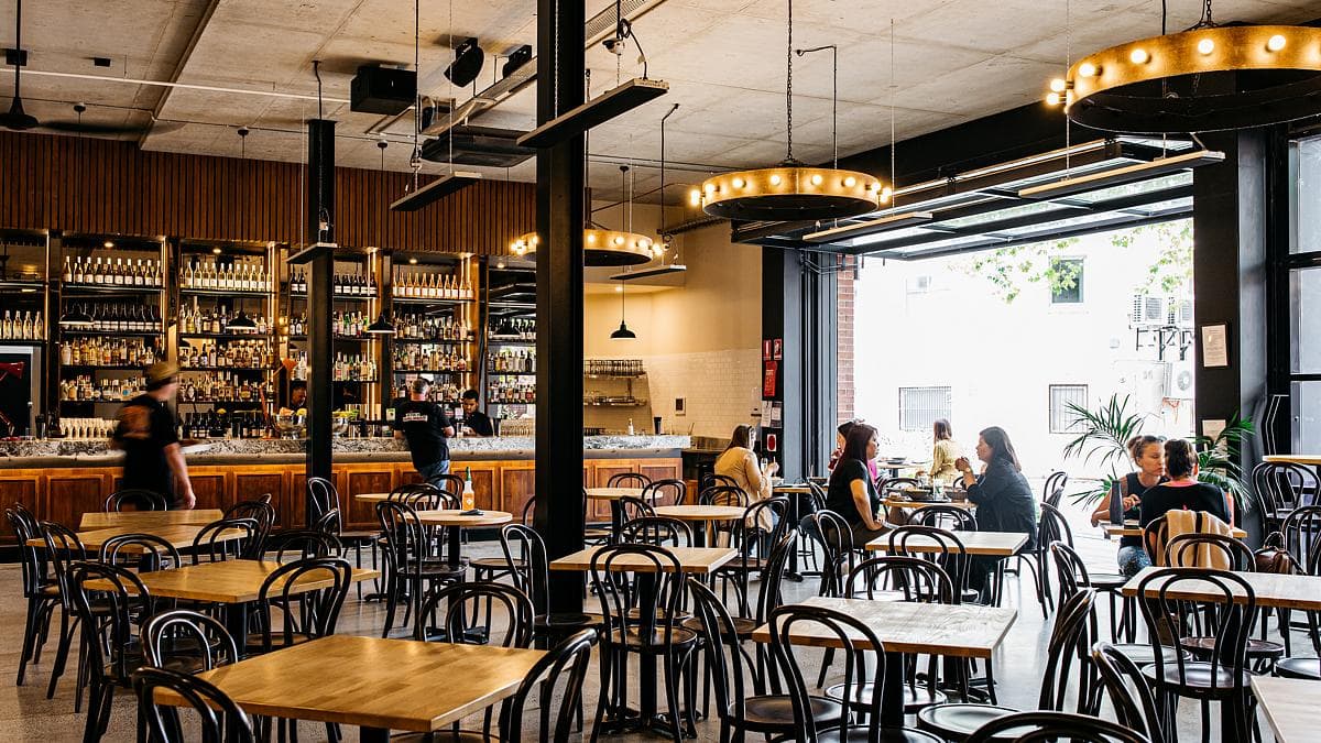 Bar and dining room opening to the laneway through a large roller door.